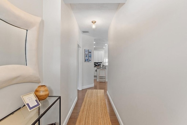 hall with light hardwood / wood-style flooring