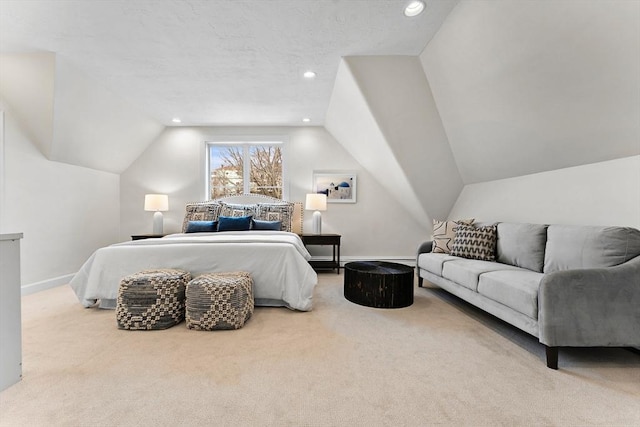 bedroom with vaulted ceiling and light carpet