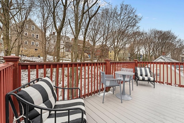 view of snow covered deck