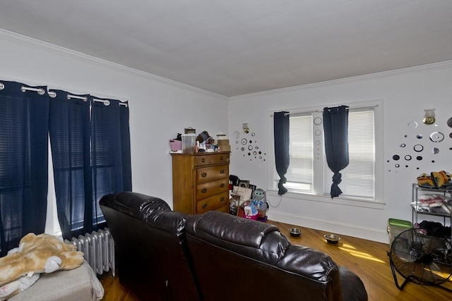 320 Oakland St, Springfield, MA 01108 - living area featuring crown molding, radiator heating unit, wood finished floors, and baseboards
