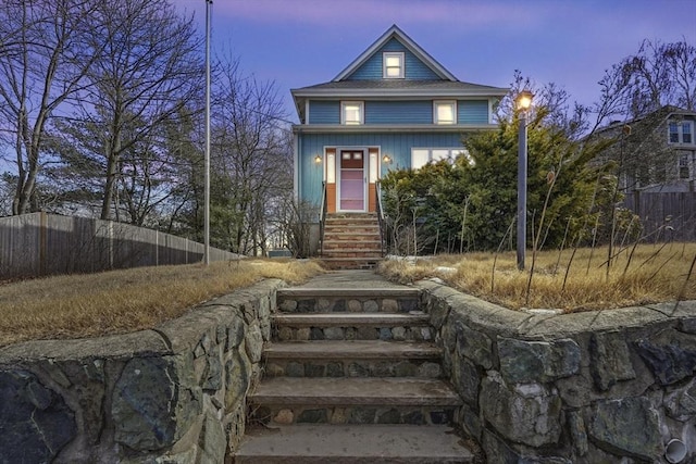 view of front of home with fence