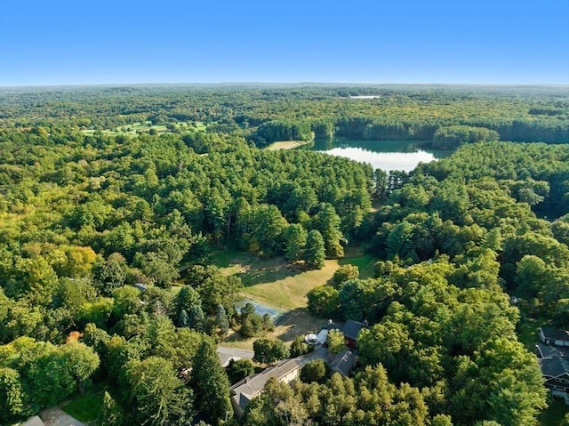 drone / aerial view with a water view and a wooded view