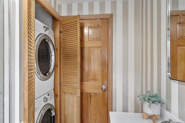 25 Ocallaghan Way, Lynn, MA 01905 - laundry area with stacked washer / drying machine and wallpapered walls