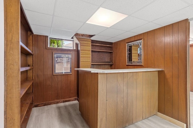 25 Ocallaghan Way, Lynn, MA 01905 - bar area featuring built in shelves, wooden walls, light wood-style flooring, and a drop ceiling