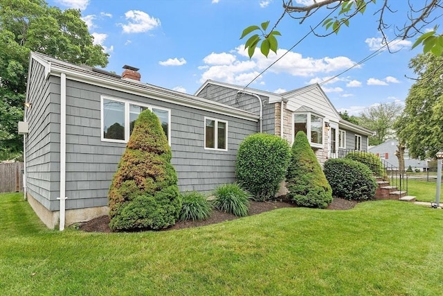 25 Ocallaghan Way, Lynn, MA 01905 - view of home's exterior featuring a chimney