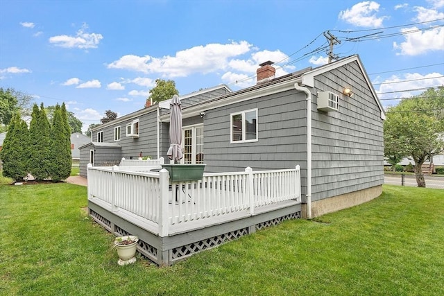 25 Ocallaghan Way, Lynn, MA 01905 - back of house with a chimney, a deck, and a lawn