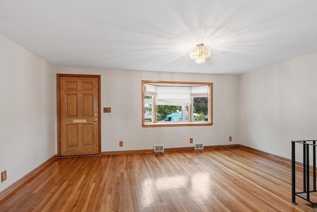 25 Ocallaghan Way, Lynn, MA 01905 - unfurnished living room featuring a chandelier and light wood finished floors