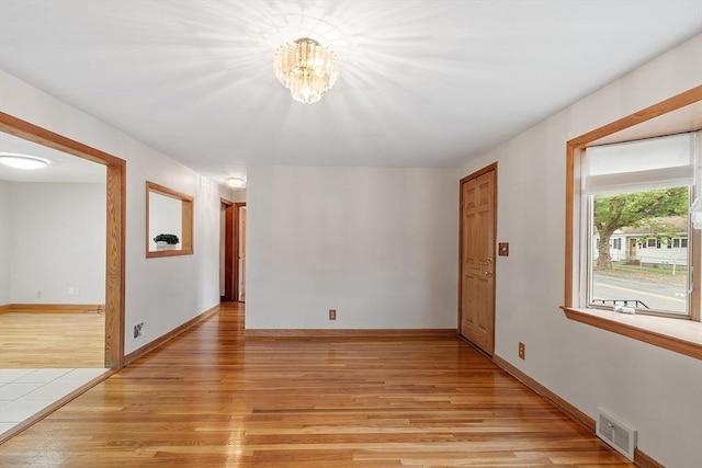 25 Ocallaghan Way, Lynn, MA 01905 - empty room with light wood-style flooring and a chandelier
