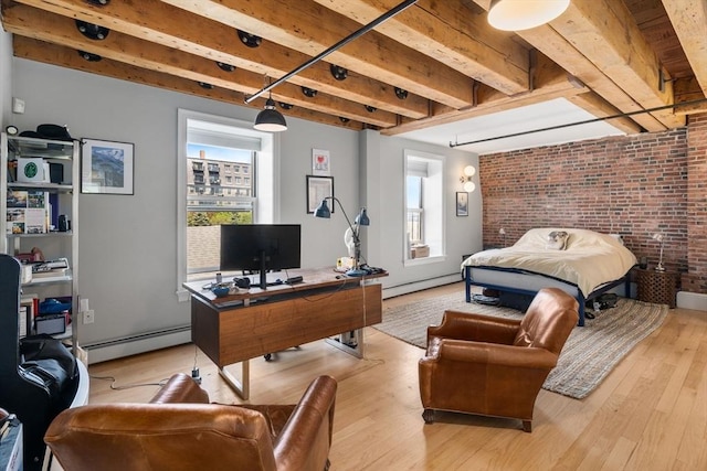 33 Commercial Wharf Unit 33A, Boston, MA 02110 - bedroom with baseboard heating, multiple windows, a baseboard radiator, a desk, and brick wall