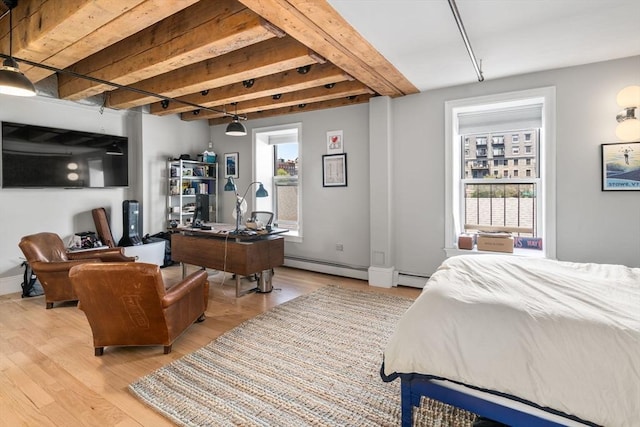 33 Commercial Wharf Unit 33A, Boston, MA 02110 - bedroom featuring beamed ceiling, light wood-type flooring, multiple windows, a baseboard radiator, and an office area