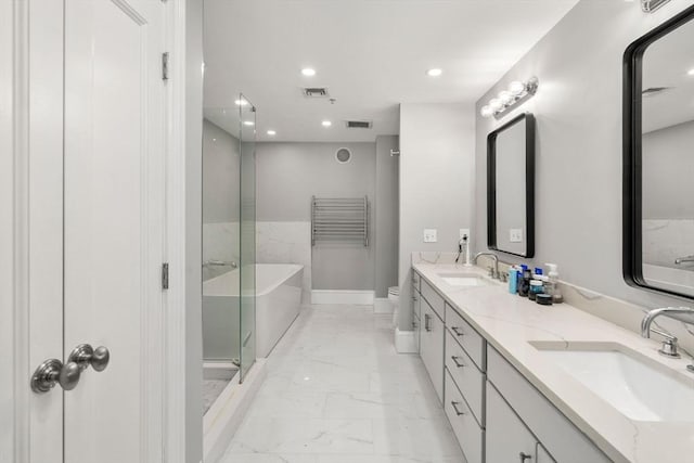 33 Commercial Wharf Unit 33A, Boston, MA 02110 - bathroom with marble look tiles, double vanity, a bathtub, toilet, and recessed lighting
