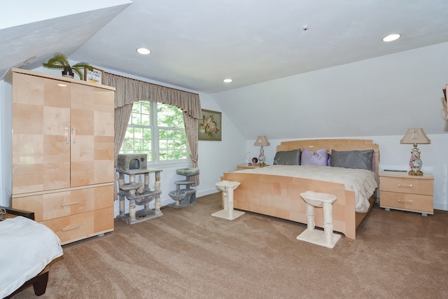 bedroom featuring lofted ceiling and carpet flooring