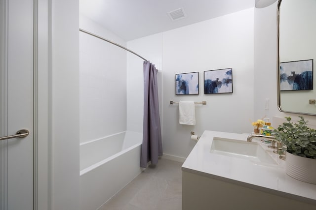 bathroom with shower / tub combo and vanity