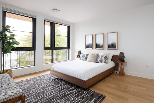 bedroom featuring wood-type flooring