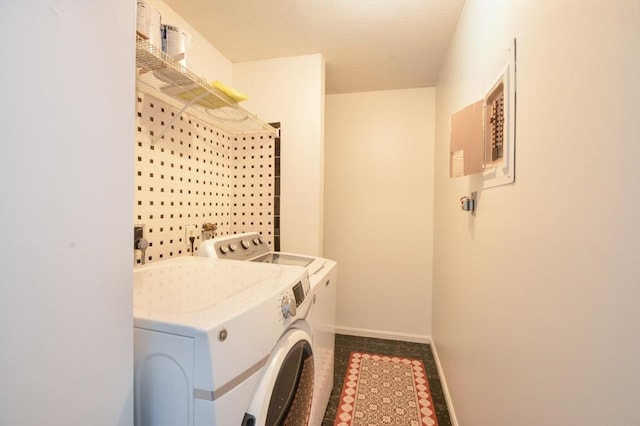 clothes washing area featuring washer and dryer