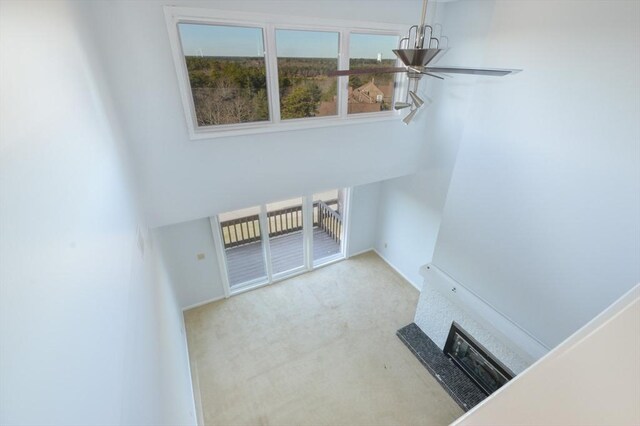 unfurnished living room with light colored carpet