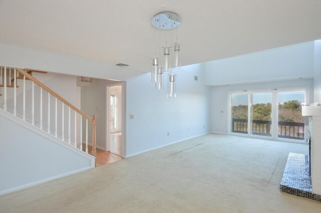 unfurnished living room featuring light carpet