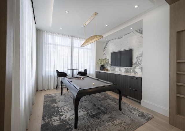 rec room with pool table, light wood finished floors, built in shelves, and recessed lighting