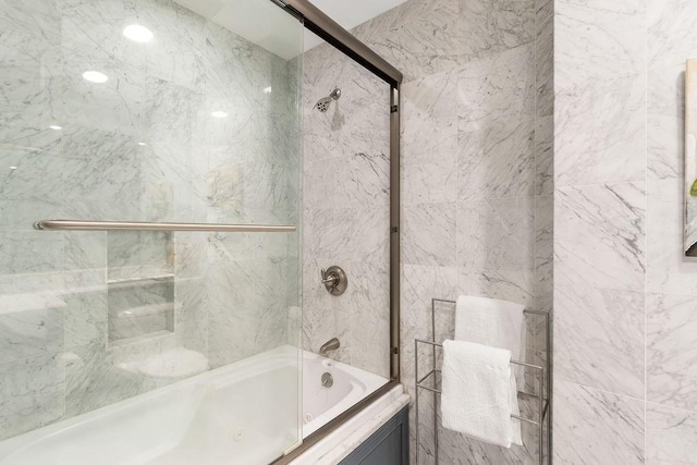 full bath with combined bath / shower with glass door