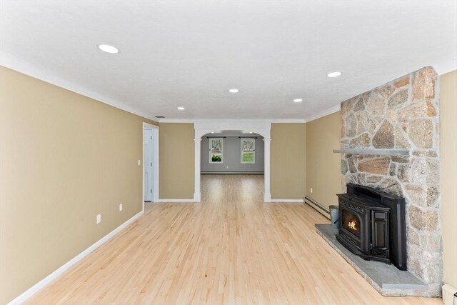3 Centennial Dr, Blackstone, MA 01504 - unfurnished living room with crown molding, wood finished floors, baseboards, baseboard heating, and a baseboard radiator