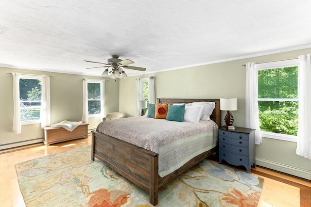 3 Centennial Dr, Blackstone, MA 01504 - bedroom featuring ceiling fan, baseboard heating, wood finished floors, a baseboard radiator, and ornamental molding