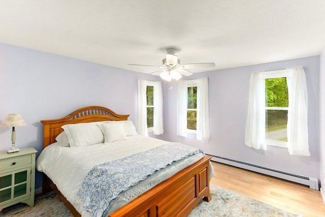 3 Centennial Dr, Blackstone, MA 01504 - bedroom featuring a baseboard radiator, ceiling fan, and wood finished floors