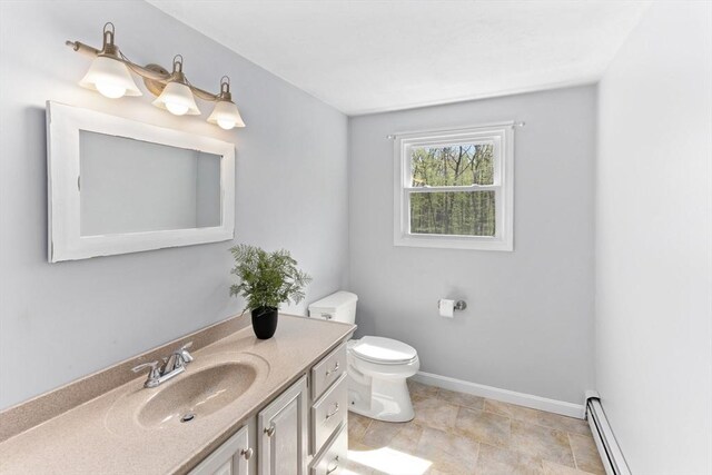 3 Centennial Dr, Blackstone, MA 01504 - bathroom with vanity, a baseboard radiator, baseboards, and toilet