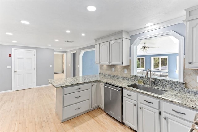 3 Centennial Dr, Blackstone, MA 01504 - kitchen with crown molding, ceiling fan, a sink, a peninsula, and stainless steel dishwasher