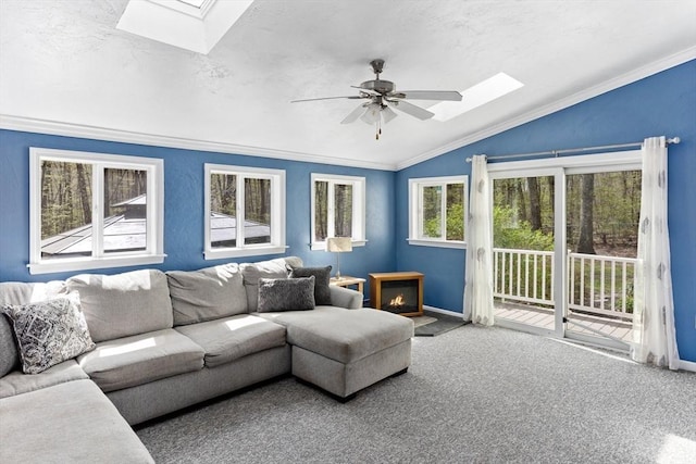 3 Centennial Dr, Blackstone, MA 01504 - carpeted living room featuring crown molding, a ceiling fan, baseboards, and vaulted ceiling with skylight