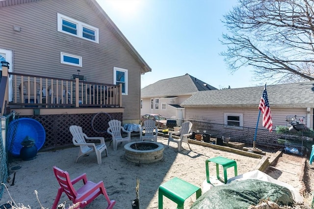 exterior space featuring a fire pit and a deck