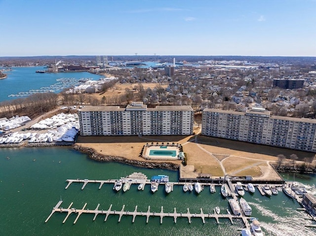 birds eye view of property with a view of city and a water view