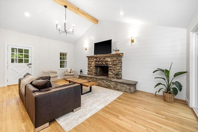 98 Old Forge Rd, Scituate, MA 02066 - living room featuring light wood-style flooring, a chandelier, and a stone fireplace
