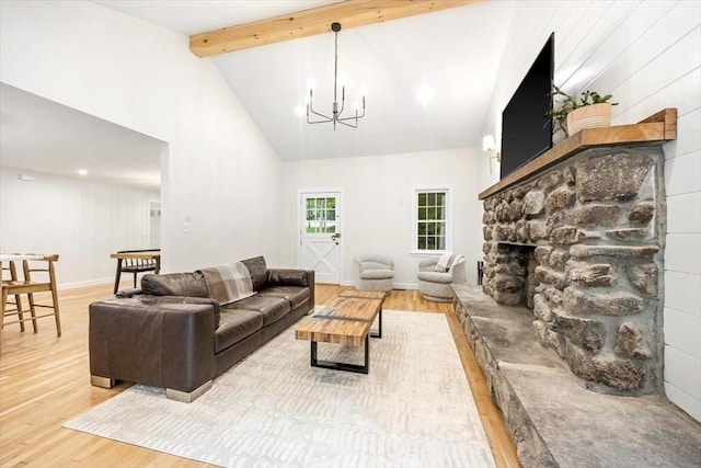98 Old Forge Rd, Scituate, MA 02066 - living area with light wood-style flooring, a fireplace, a chandelier, beam ceiling, and high vaulted ceiling