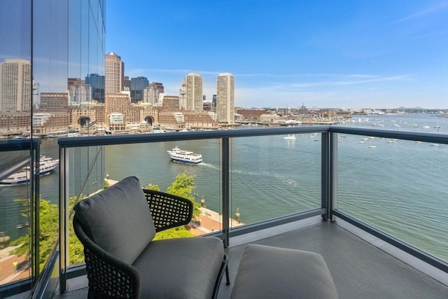 balcony featuring a water view