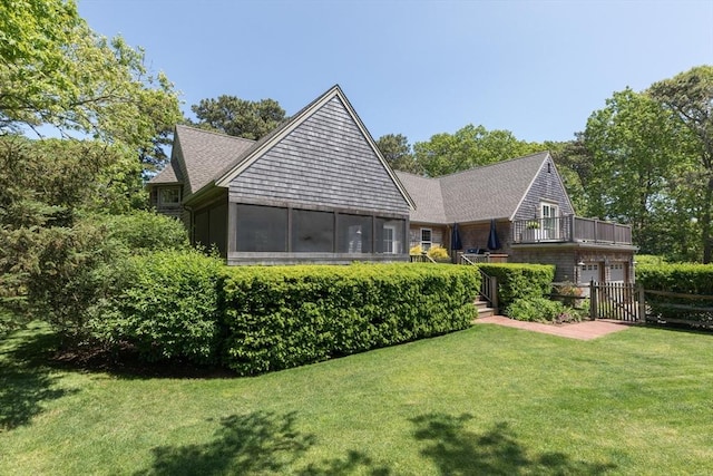 28 Marthas Rd, Edgartown, MA 02539 - rear view of house featuring a sunroom and a balcony