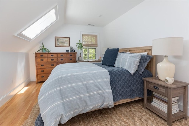 28 Marthas Rd, Edgartown, MA 02539 - bedroom with a skylight, lofted ceiling, and light wood finished floors