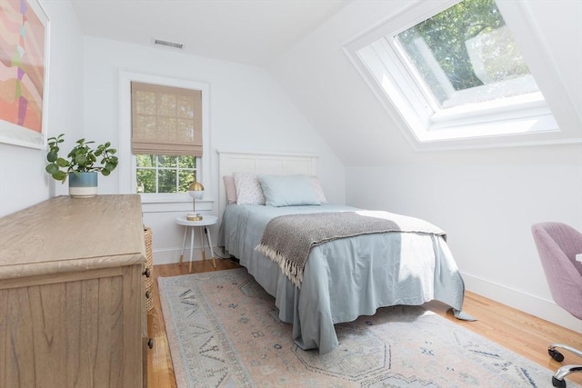 28 Marthas Rd, Edgartown, MA 02539 - bedroom featuring a skylight, vaulted ceiling, and light wood finished floors