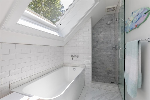 28 Marthas Rd, Edgartown, MA 02539 - full bathroom featuring a skylight, a garden tub, a shower stall, vaulted ceiling, and marble look tile flooring