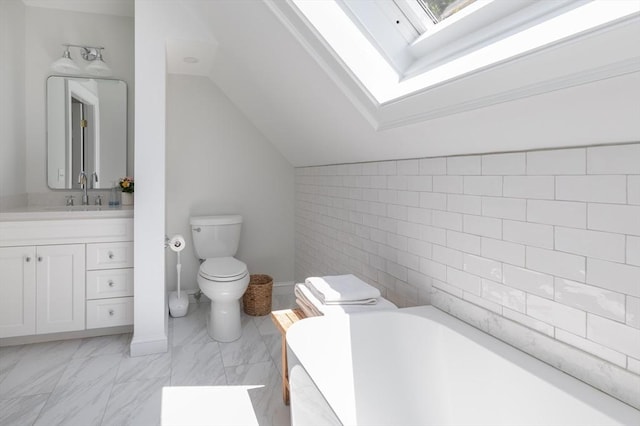 28 Marthas Rd, Edgartown, MA 02539 - full bathroom with a skylight, a garden tub, lofted ceiling, vanity, and marble look tiles