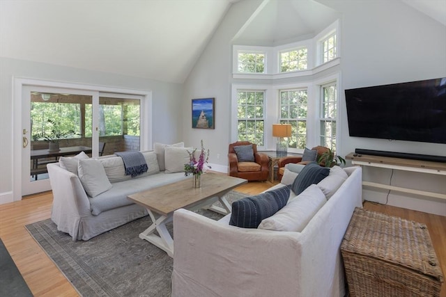 28 Marthas Rd, Edgartown, MA 02539 - living area with high vaulted ceiling, plenty of natural light, and light wood-style flooring