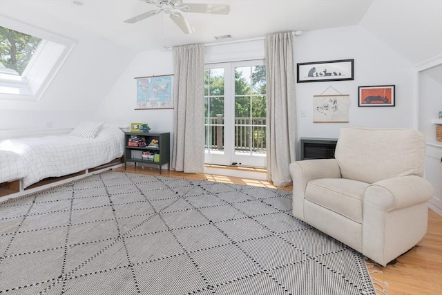 28 Marthas Rd, Edgartown, MA 02539 - bedroom with vaulted ceiling, access to exterior, wood finished floors, and a skylight