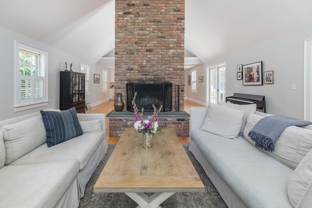 28 Marthas Rd, Edgartown, MA 02539 - living room featuring vaulted ceiling, a fireplace, and wood finished floors