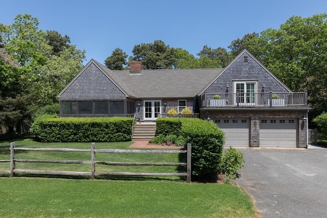 28 Marthas Rd, Edgartown, MA 02539 - view of front of home featuring driveway, a garage, french doors, and a balcony
