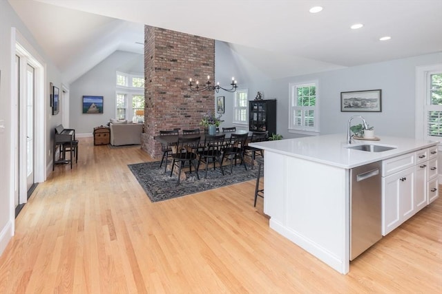 28 Marthas Rd, Edgartown, MA 02539 - kitchen featuring dishwasher, lofted ceiling, healthy amount of natural light, white cabinets, and light wood-style flooring