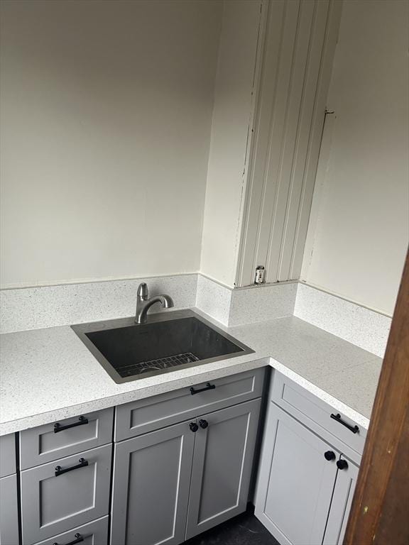 29 Tatman St, Worcester, MA 01607 - kitchen featuring a sink and gray cabinetry