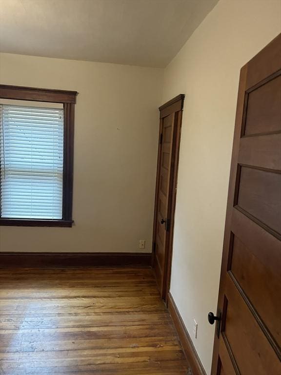 29 Tatman St, Worcester, MA 01607 - empty room with dark wood-type flooring and baseboards