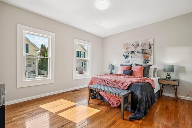 45 Stanley St, Lowell, MA 01850 - bedroom with multiple windows and hardwood / wood-style floors