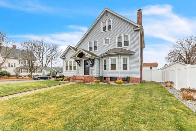 front facade featuring a front yard