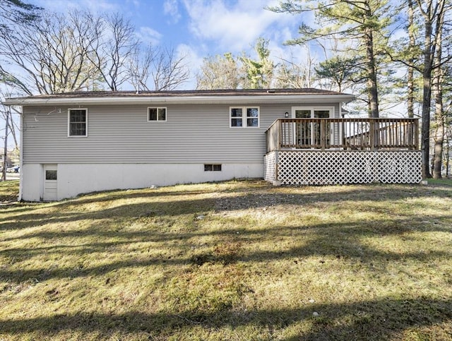 back of house with a yard and a deck