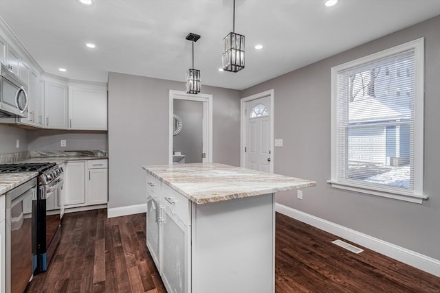 70 Sanborn St, Fitchburg, MA 01420 - kitchen with stainless steel appliances, baseboards, recessed lighting, and dark wood-style floors